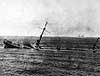 Ex German warship sinking after aerial bombing.